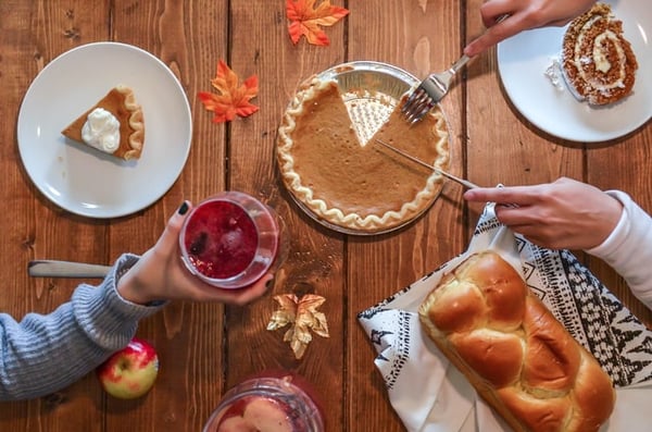 Pumpkin pie with sweet bread and cranberry juice for Thanksgiving to teach gratitude and share US culture and customs