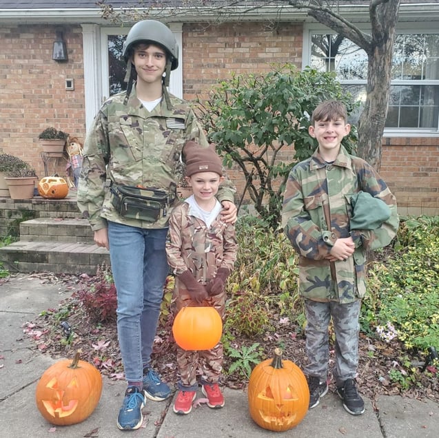 teen boy and young boys trick or treating