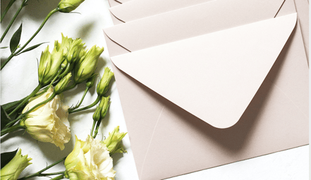 Beige envelope with white flowers