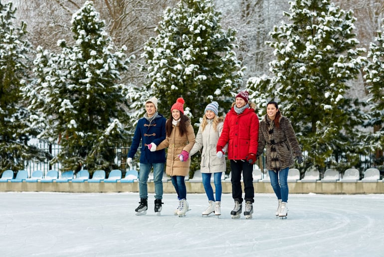 People ice skating outdoors