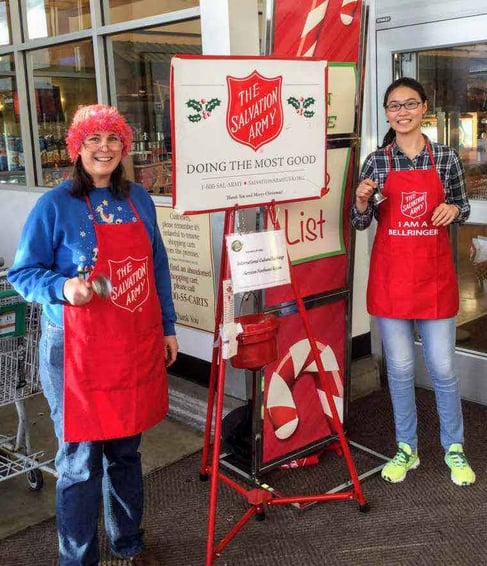 teen girl and host mom ringing the Salvation Army bell