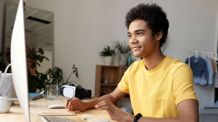 Teen boy taking an online course