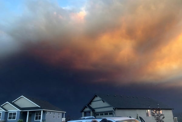 ominous black smoke approaching homes