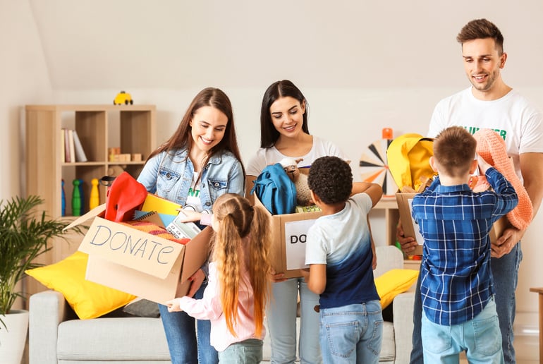 Family filling donation boxes
