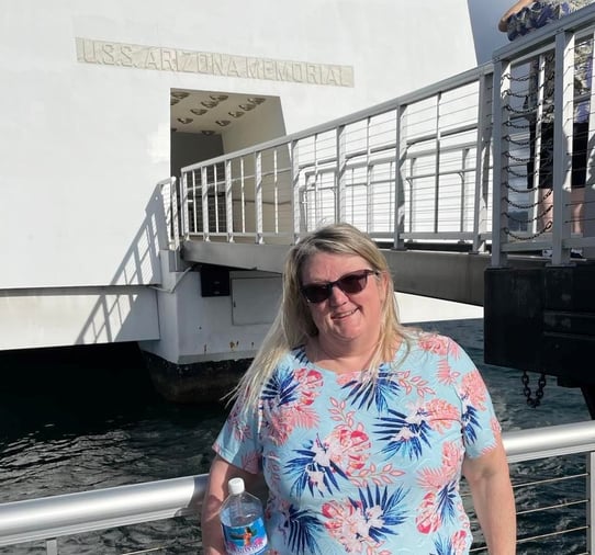 woman in front of USS Arizona