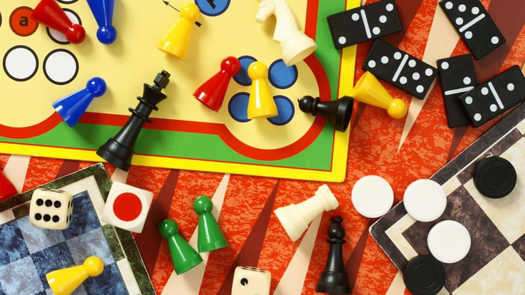 a collection of board games displayed on a table