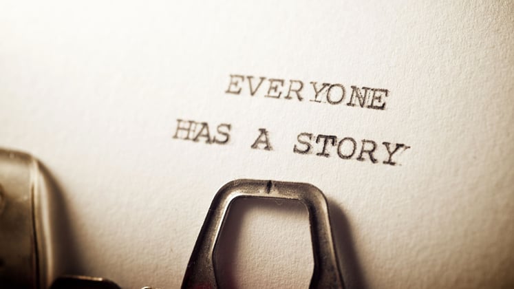 a typewriter typing everyone has a story