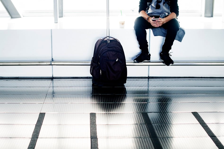 boy with backpack at airport