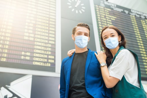 masked teens at airport