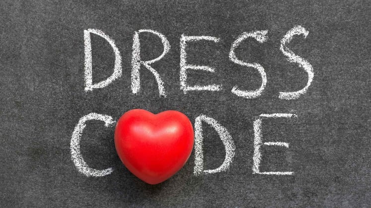blackboard with the words dress code and a heart