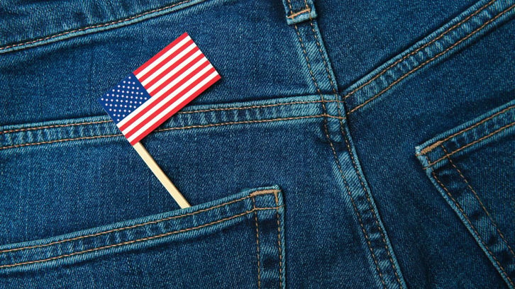 blue jeans with an american flag in the pocket