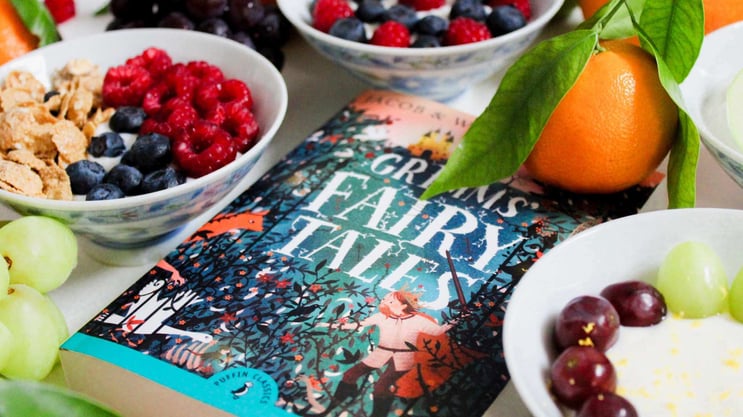 book of fairy tales with breakfast food