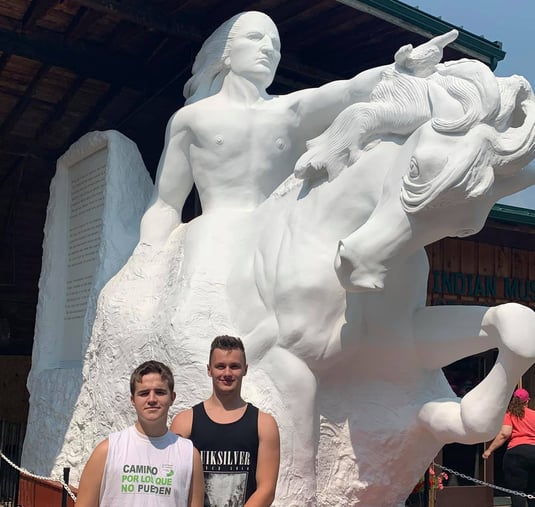 boys in front of Crazy Horse Memorial statue