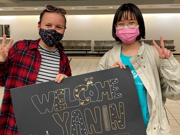 Czech exchange student welcomes her Thai host sister at the airport