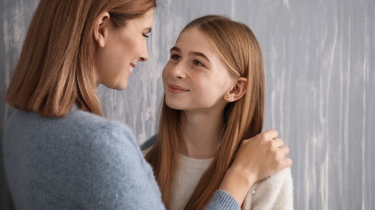 daughter looking into mothers eyes with gratitude