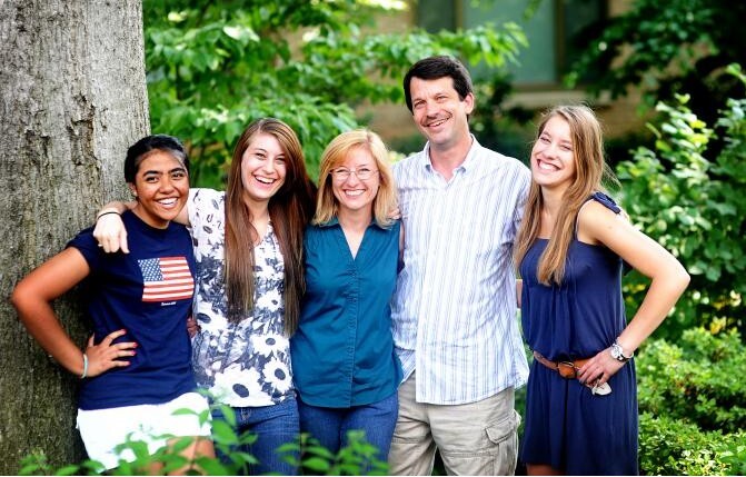 family outside with student