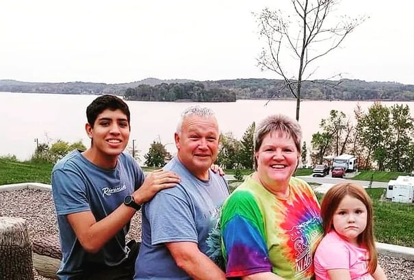 family photo of mother, father, daughter and exchange student from colombia