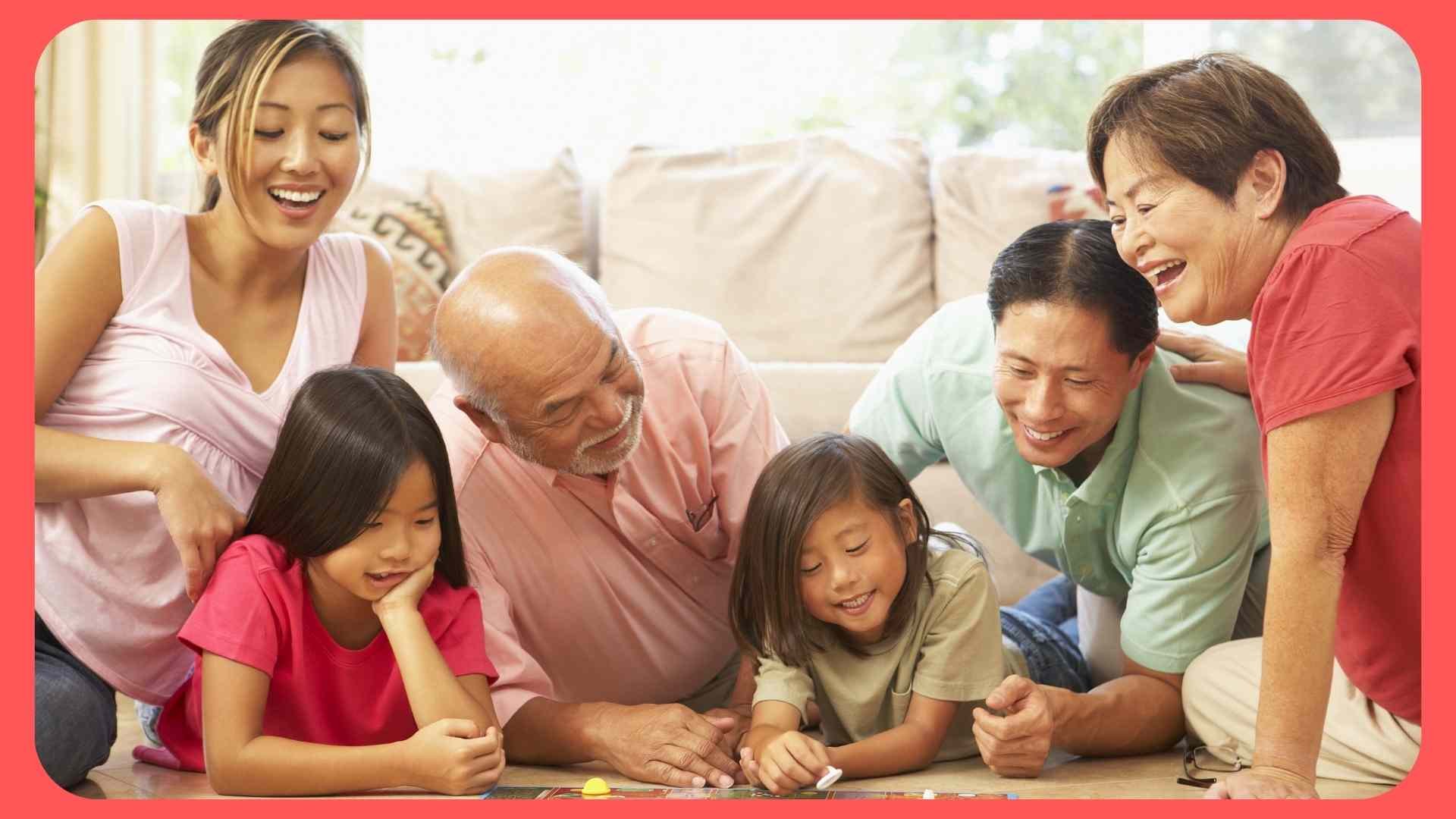 family playing board game on the floor