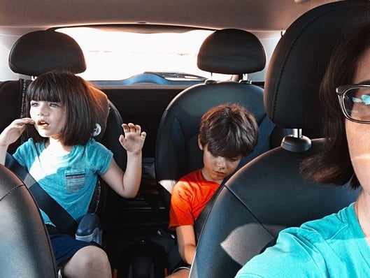 kids in the back seat of the car