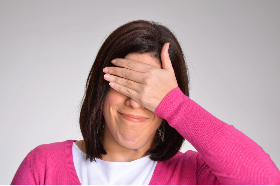 woman with hand over eyes