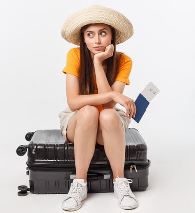girl sitting on suitcase