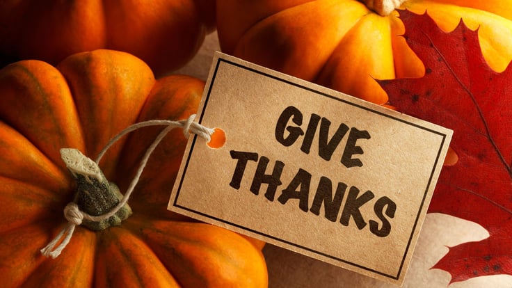 give thanks sign with pumpkins