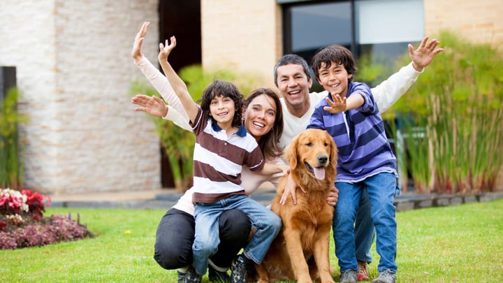 happy family outside their home
