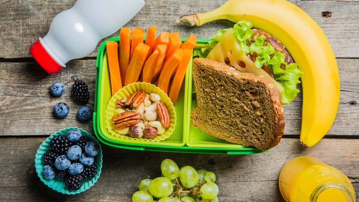 healthy school lunch with fruit and fresh veggies