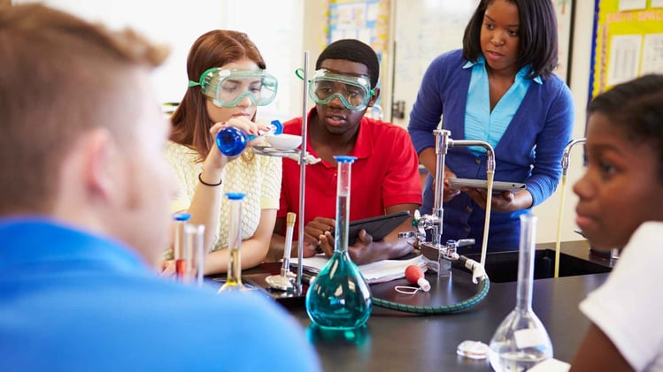 high school students in science lab class