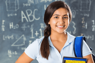 girl in front of chalkboard
