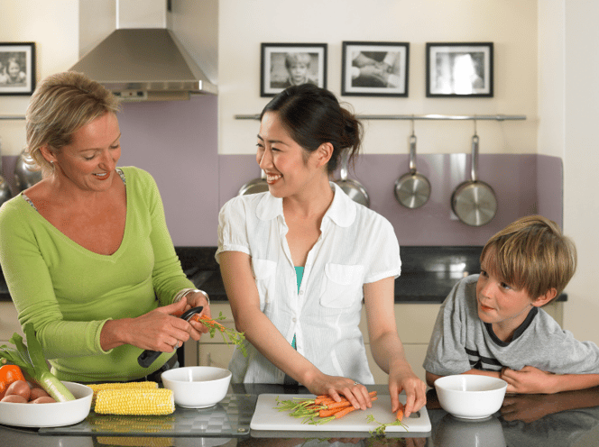 mom and child cooking with exchange student