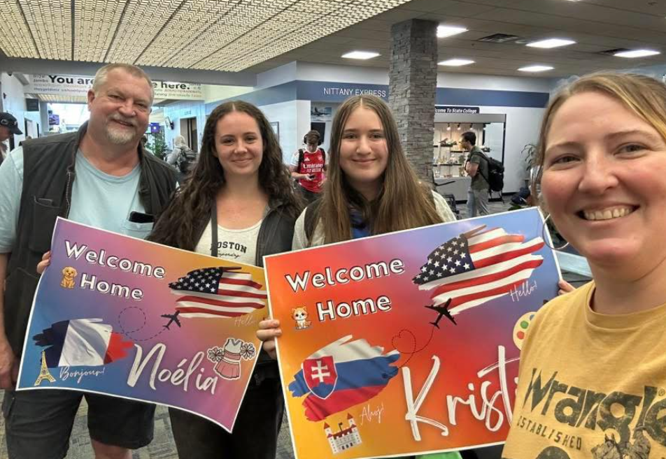 family welcoming two female exchange students