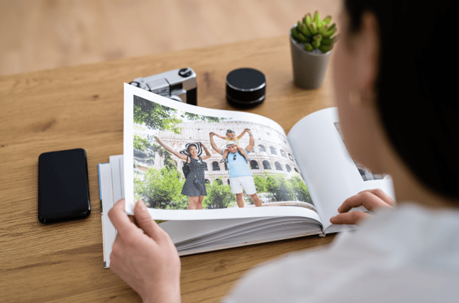 girl looking at custom photo book