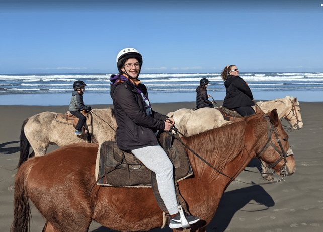 girl riding a horse on the beach