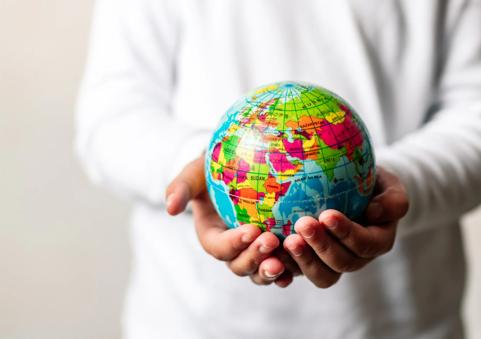hands holding globe