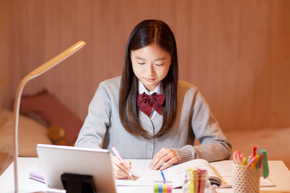 Japanese girl working at desk