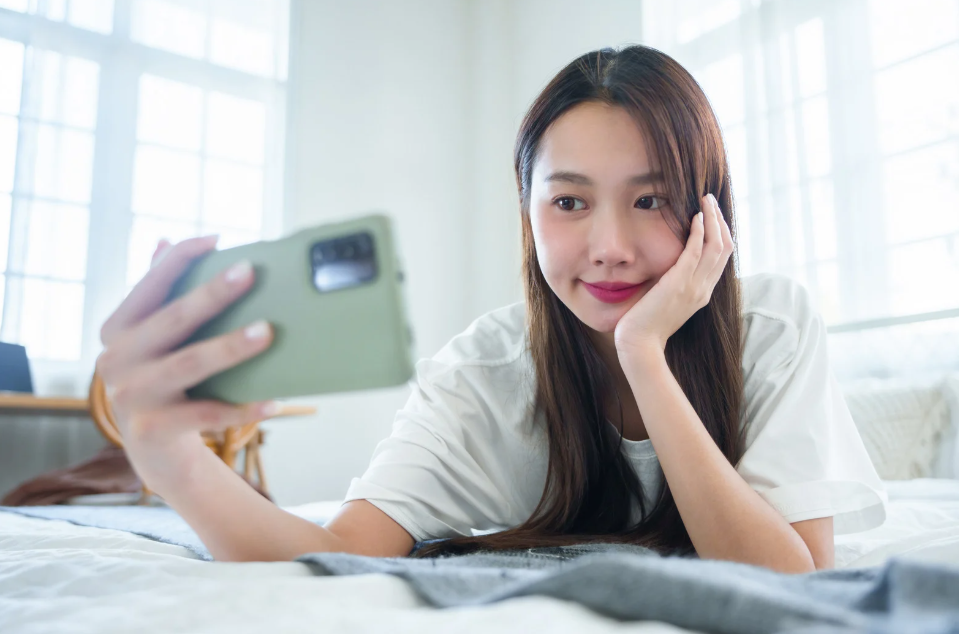 Korean girl looking at phone