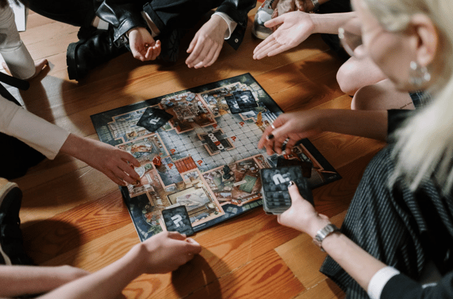family around a board game