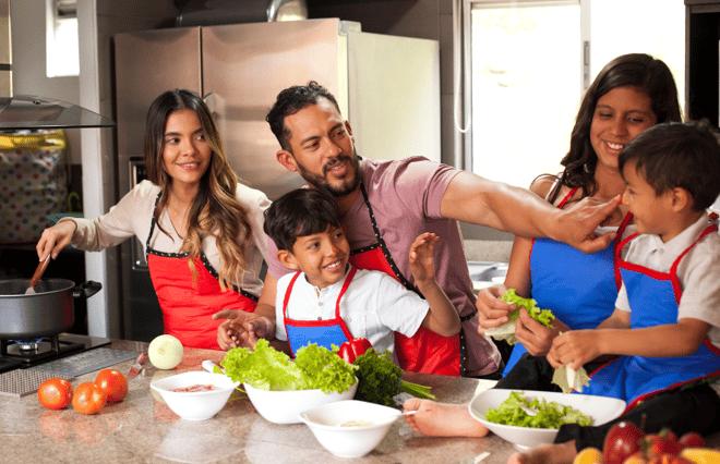Playful family cooking together