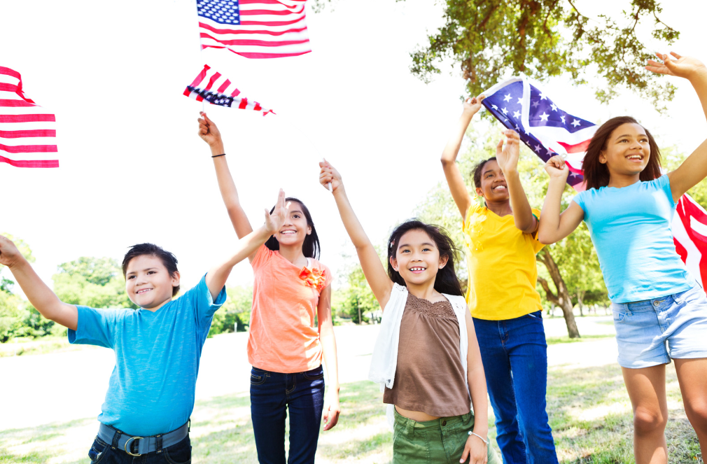 kids waving American flags