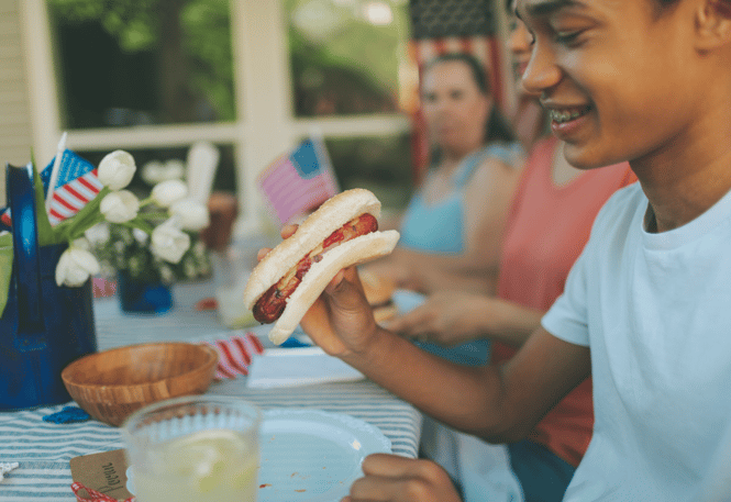 boy eating a hot dog