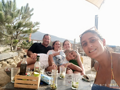 family on beach in Spain
