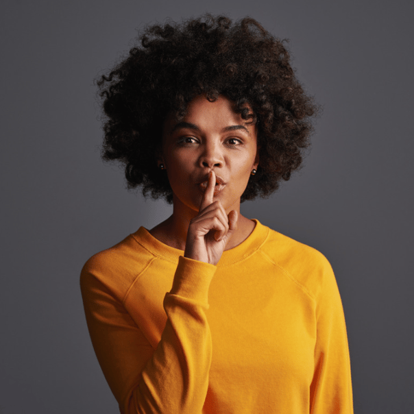 girl making shhh sign