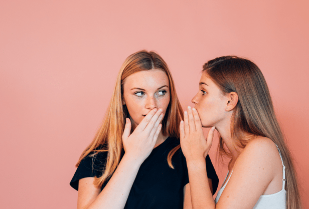 two girls gossiping