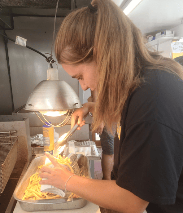 girl serving french fries