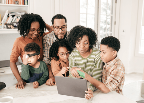 family looking at computer