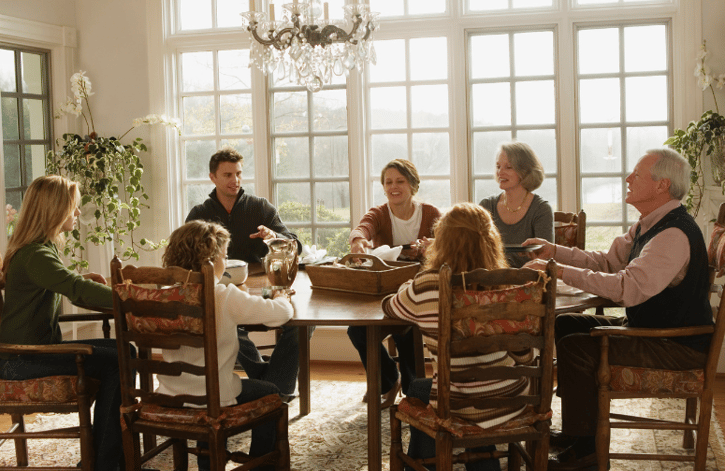 family around a large dining table