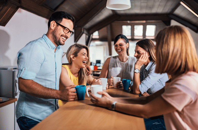 group of people drinking coffee and laughing