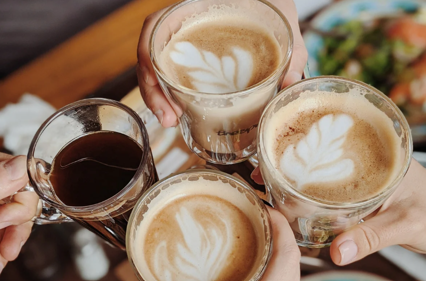 four cups of coffee toasting