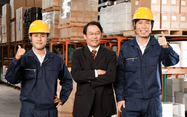 3 Japanese workers in a warehouse